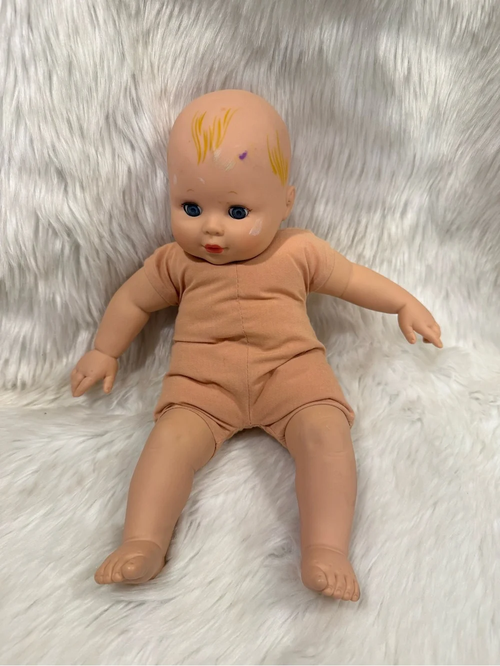 Madame Alexander 2010 Peach Vinyl Head Baby Doll with Blue Eyes